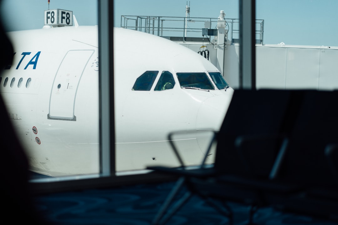 White and blue airplane during daytime